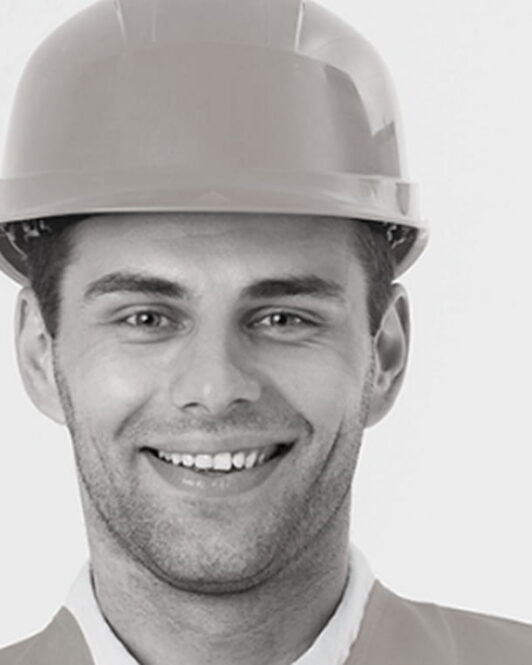 smiling-construction-engineer-posing-with-arms-crossed