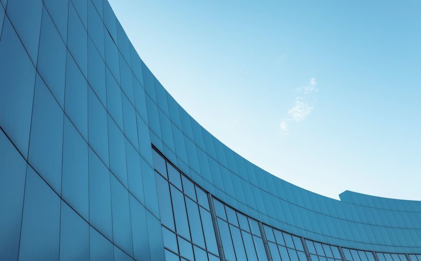 corporate-building-blue-sky-background-with-isolated-place-text